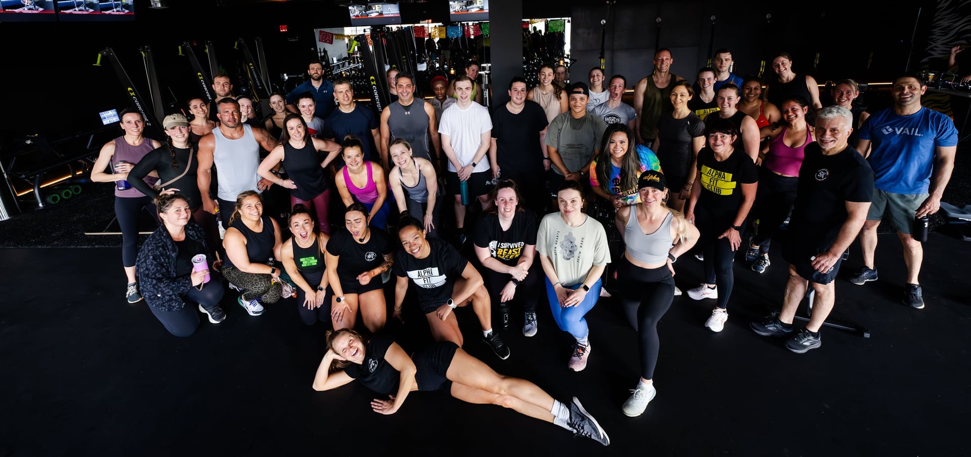 A group photo of fit, smiling Alpha Fit Club members.